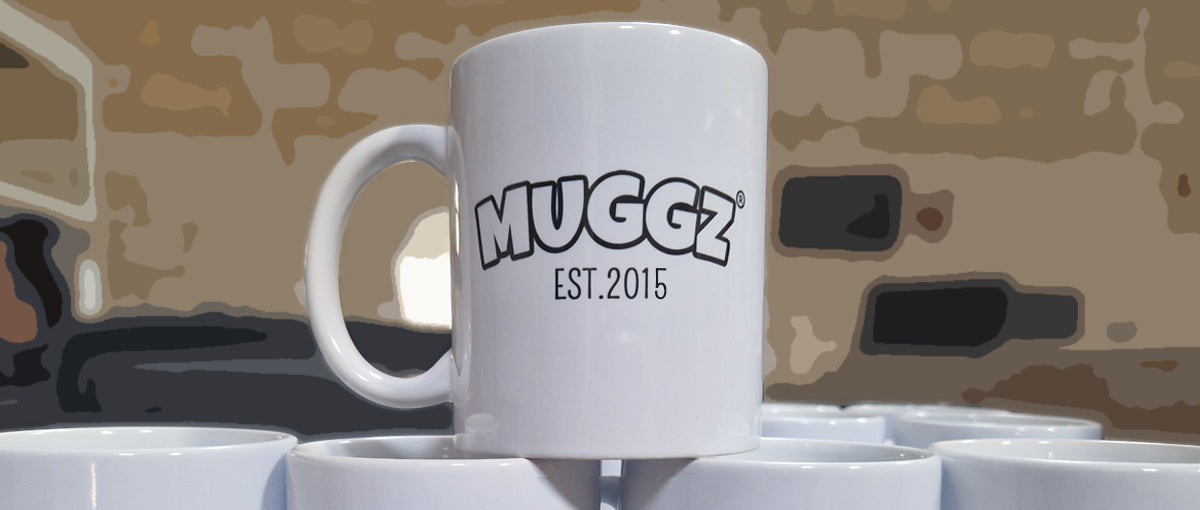White mug with 'Muggz' branding on a camouflage background